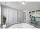 Well-lit bedroom with double doors and modern art at 71 Macy Cir, Wendell, NC 27591