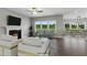 Open living room with fireplace, hardwood floors, and access to the kitchen at 71 Macy Cir, Wendell, NC 27591