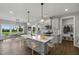Open concept kitchen and dining area with view to backyard at 71 Macy Cir, Wendell, NC 27591