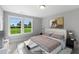 Spacious bedroom with large windows and backyard view at 71 Macy Cir, Wendell, NC 27591