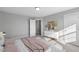 Well-lit bedroom with large windows and backyard view at 71 Macy Cir, Wendell, NC 27591