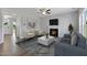 Cozy living room features a fireplace and ample natural light at 71 Macy Cir, Wendell, NC 27591