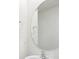 Clean bathroom with an oval mirror and white sink at 210 Bay Laurel Dr, Sanford, NC 27332