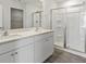 Elegant bathroom with double vanity, large mirror, and a spacious shower at 210 Bay Laurel Dr, Sanford, NC 27332