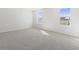 Spacious bedroom with neutral carpeting and two large windows at 210 Bay Laurel Dr, Sanford, NC 27332