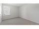 Simple bedroom with carpeted floor and a window at 210 Bay Laurel Dr, Sanford, NC 27332