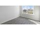 Bright bedroom with gray wood-look flooring and large window at 210 Bay Laurel Dr, Sanford, NC 27332