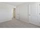Bright bedroom with carpeted floor and access to bathroom at 210 Bay Laurel Dr, Sanford, NC 27332
