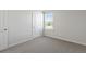Well-lit bedroom with carpet and a window at 210 Bay Laurel Dr, Sanford, NC 27332