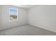 Well-lit bedroom with large window and neutral wall colors at 210 Bay Laurel Dr, Sanford, NC 27332