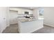 Modern kitchen island with granite countertop and white cabinets at 210 Bay Laurel Dr, Sanford, NC 27332