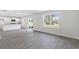 Kitchen features white cabinets, granite counters and island at 210 Bay Laurel Dr, Sanford, NC 27332