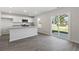 Eat-in kitchen with white cabinets, granite countertops and island at 210 Bay Laurel Dr, Sanford, NC 27332