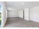Open living space with vinyl flooring and access to stairs at 210 Bay Laurel Dr, Sanford, NC 27332