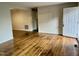 Bright and airy living room featuring hardwood floors and access to other rooms at 733 Carlisle St, Raleigh, NC 27610