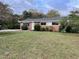 Brick ranch home with a well-maintained lawn at 733 Carlisle St, Raleigh, NC 27610