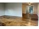 Hardwood floors throughout the spacious living room, with a view into the adjacent dining area at 733 Carlisle St, Raleigh, NC 27610