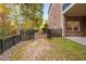 Landscaped backyard with fence and path at 3007 Olde Weatherstone Way, Cary, NC 27513
