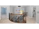 Upstairs hallway with an ornate railing and chandelier at 3007 Olde Weatherstone Way, Cary, NC 27513