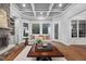 Gathering room with stone fireplace and built-in shelving at 3007 Olde Weatherstone Way, Cary, NC 27513