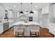 Modern kitchen with white cabinets and large island at 3007 Olde Weatherstone Way, Cary, NC 27513