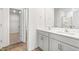 Double vanity bathroom with gray cabinets and a large shower at 317 Leven Dr, Gibsonville, NC 27249