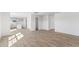 Open living room with kitchen and powder room access at 317 Leven Dr, Gibsonville, NC 27249