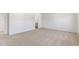 Spacious bedroom with neutral carpeting and access to bathroom at 317 Leven Dr, Gibsonville, NC 27249