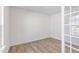 Bright home office featuring wood-look flooring and a French door at 317 Leven Dr, Gibsonville, NC 27249