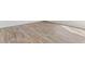 Light brown wood-look flooring in a bright room at 317 Leven Dr, Gibsonville, NC 27249