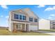 Two-story home with stone accents and a two-car garage at 317 Leven Dr, Gibsonville, NC 27249