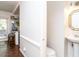 Small half bathroom with pedestal sink and toilet at 3736 Jamestown Cir, Raleigh, NC 27609