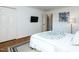 Bedroom with hardwood floors and double doors at 3736 Jamestown Cir, Raleigh, NC 27609