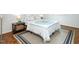 Bedroom with hardwood floors and a comfortable bed at 3736 Jamestown Cir, Raleigh, NC 27609