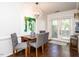 Dining area with wood table and chairs, near patio doors at 3736 Jamestown Cir, Raleigh, NC 27609