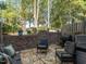 Relaxing patio with seating area, grill, and hot tub at 3736 Jamestown Cir, Raleigh, NC 27609