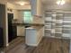 Kitchen with granite countertops, black appliances, and an island at 1111 Nottingham Cir, Cary, NC 27511