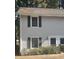 Gray vinyl sided duplex with shutters and landscaping at 1111 Nottingham Cir, Cary, NC 27511