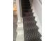Staircase with patterned runner and gray carpeting at 1111 Nottingham Cir, Cary, NC 27511