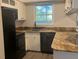 Kitchen with granite countertops and black appliances at 1111 Nottingham Cir, Cary, NC 27511