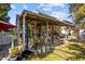 Covered patio with seating area, lush landscaping, and a pergola at 2125 Star Sapphire Dr, Raleigh, NC 27610