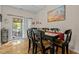 Bright dining area with hardwood floors and access to the patio at 2125 Star Sapphire Dr, Raleigh, NC 27610