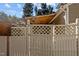 White wooden fence with a decorative gate leading to the backyard at 2125 Star Sapphire Dr, Raleigh, NC 27610