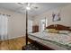 Spacious main bedroom with hardwood floors and a large bed at 2125 Star Sapphire Dr, Raleigh, NC 27610
