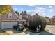 Two-story house exterior with taupe siding, attached garage, and driveway at 2125 Star Sapphire Dr, Raleigh, NC 27610
