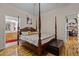 Main bedroom with hardwood floors and access to bathroom at 2125 Star Sapphire Dr, Raleigh, NC 27610