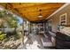 Covered patio with seating area and backyard access at 2125 Star Sapphire Dr, Raleigh, NC 27610