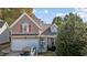 Two-story house exterior with taupe siding and attached garage at 2125 Star Sapphire Dr, Raleigh, NC 27610