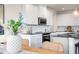 Bright kitchen with white cabinets, granite countertops, and stainless steel appliances at 160 Bering Cir, Angier, NC 27501