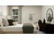 Bright bedroom with a neutral color palette and a large window at 313 Whispering Way, Sanford, NC 27330